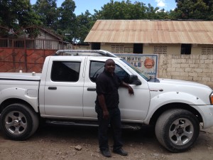 Pastor Fatton with his new truck for the orphanage.